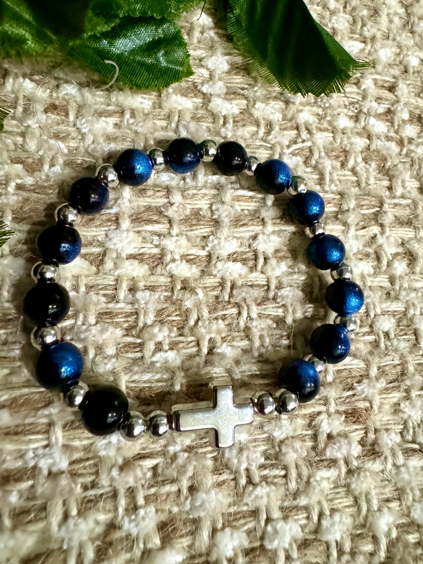 Blk/blue rounds silver cross. B