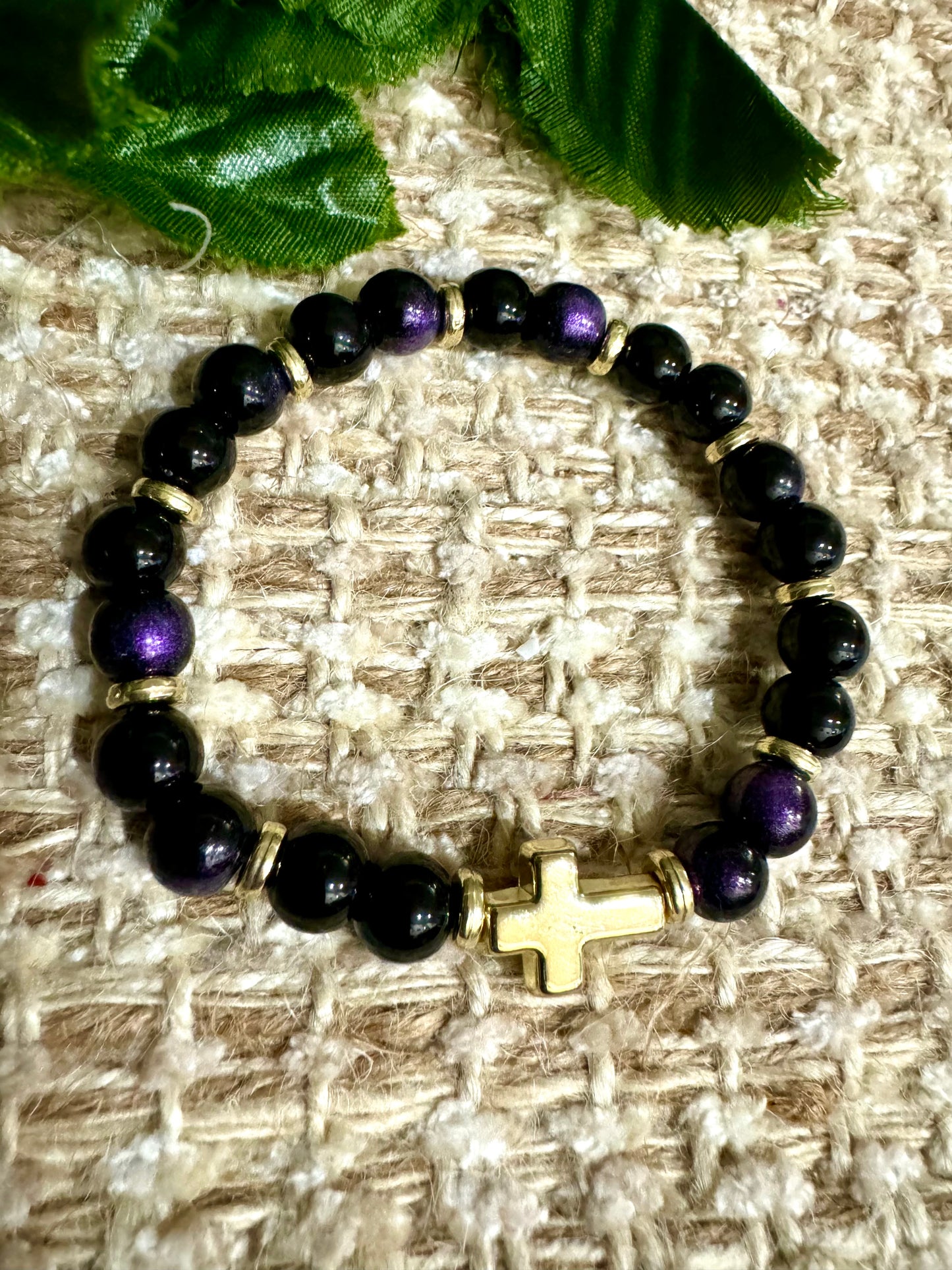 Blk/purple rounds gold cross. B